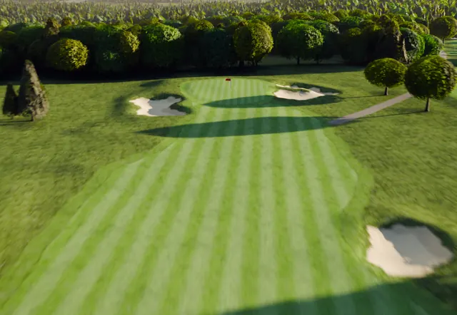 A golf green from above, set beyond two bunkers.